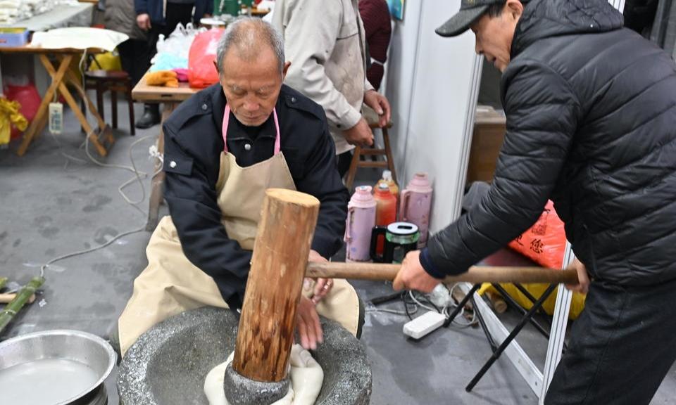 手舂年糕成农博会非遗亮点